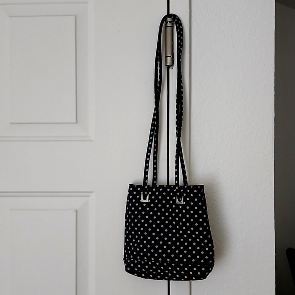 A Villager Crossbody/Shoulder Bag with cute matching ponytail holders.